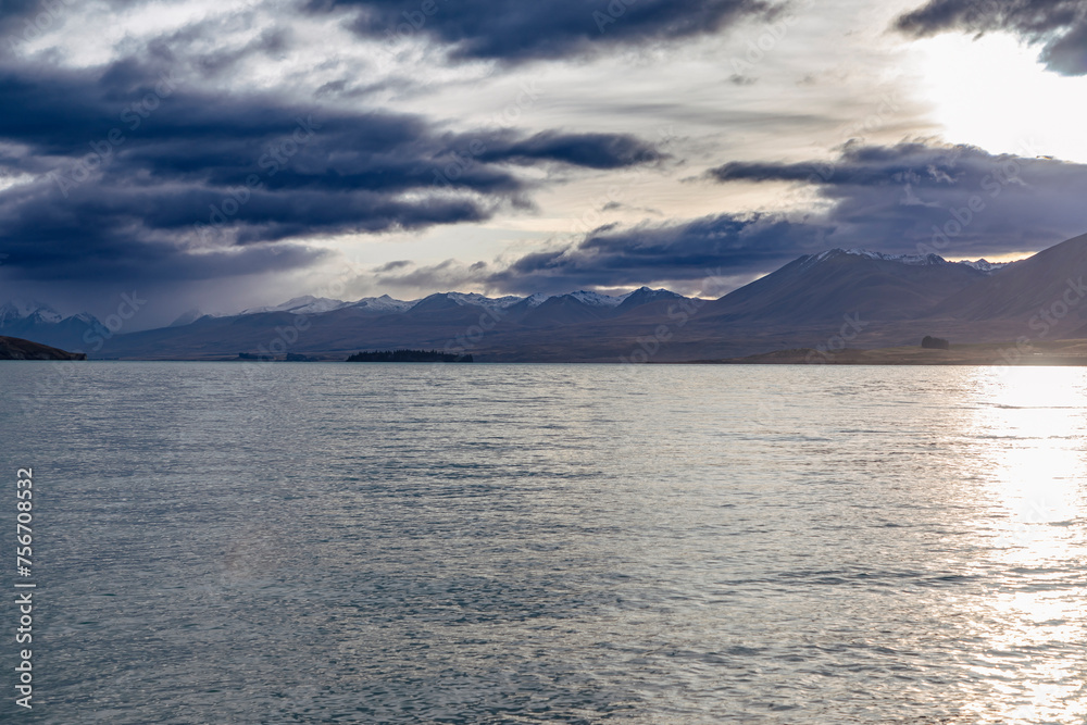 Photograph of Lake Tekapo in the early morning with snow-capped mountains in the background on the South Island of New Zealand