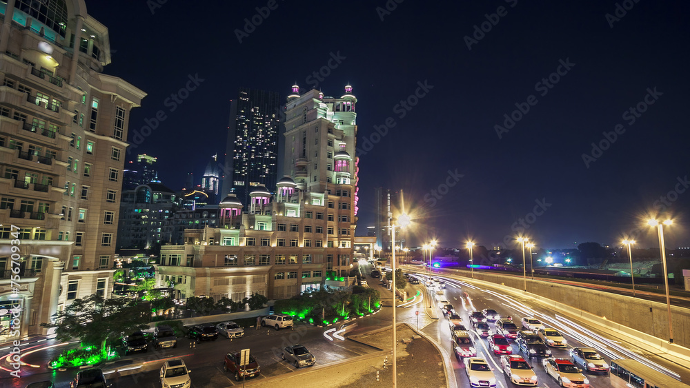 Moving cars traffic on night road in modern city Dubai timelapse hyperlapse