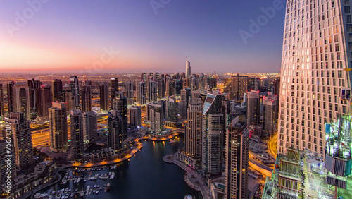 Dubai marina harbor from night to day transition timelapse