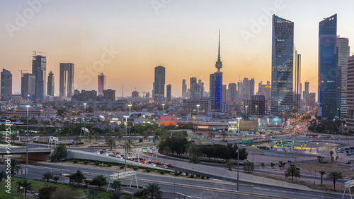 Skyline with Skyscrapers day to night timelapse in Kuwait City downtown illuminated at dusk. Kuwait City  Middle East
