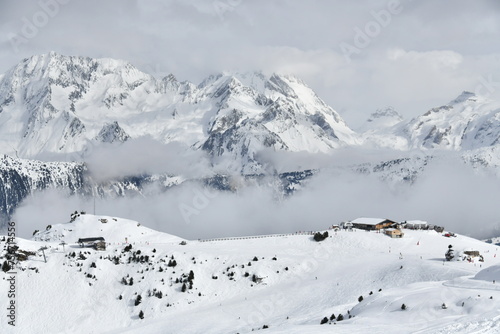 snow covered mountains and slopes of Courchevel ski resort 