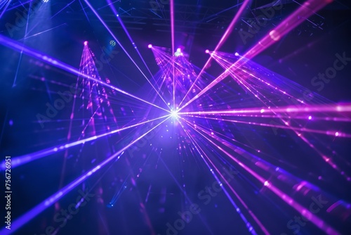 Lot of beautiful multi-colored laser beams in dark