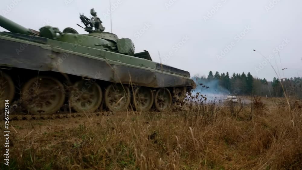 A Russian T72 tank is driving along a country road. War in Ukraine. Russian aggression in Ukraine A Russian T72 tank is driving along a country road. War in Ukraine. Russian aggression in Ukraine