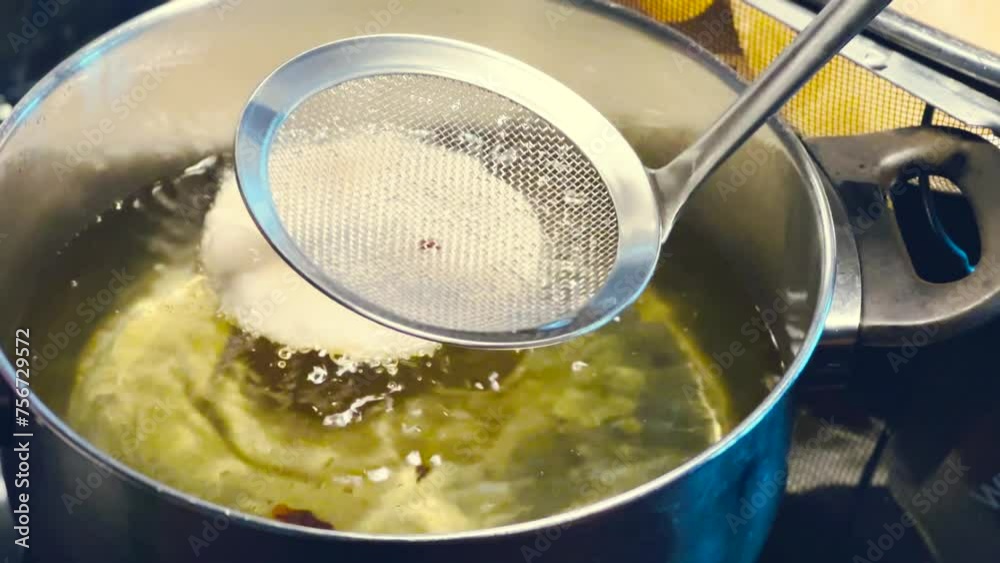 Close up shot of Indian puri fried bread being fried in oil. Fried bread preparation in Indian street in morning time. 4k. Vegetable dish. Indian Dish or Cuisine Close up shot of Indian puri fried bread being fried in oil. Fried bread preparation in Indian street in morning time. 4k. Vegetable dish. Indian Dish or Cuisine