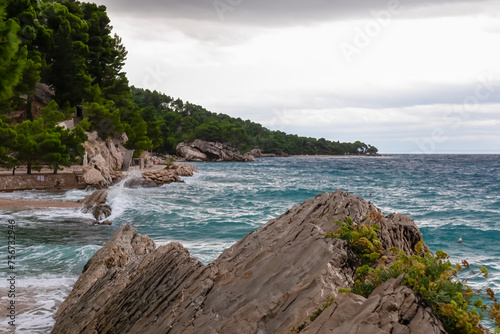 Fototapeta Naklejka Na Ścianę i Meble -  Unique rock formations at idyllic paradise beach Punta Rata in coastal town Brela, pearl of Makarska Riviera in Dalmatia, Croatia. Majestic coastline of Adriatic Mediterranean Sea in summer. Serenity