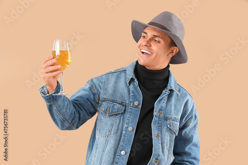 Happy young man with glass ...