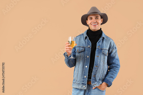 Happy young man with glass ...