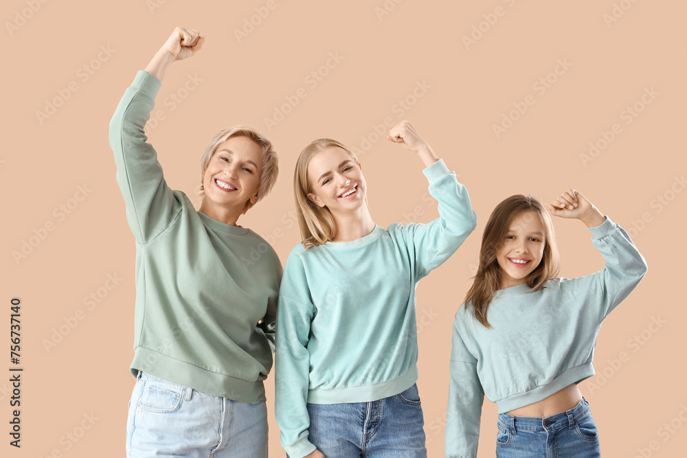 Happy little girl with her mom and grandmother on beige background - obrazy, fototapety, plakaty 