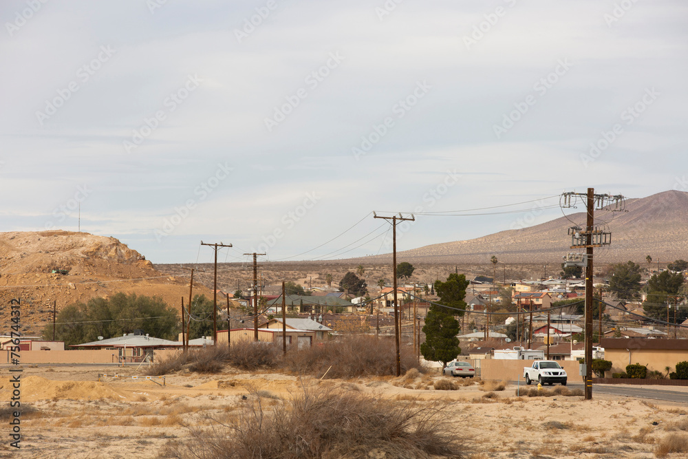 Power lines frame a neighborhood in Barstow, California, USA. Power lines frame a neighborhood in Barstow, California, USA.