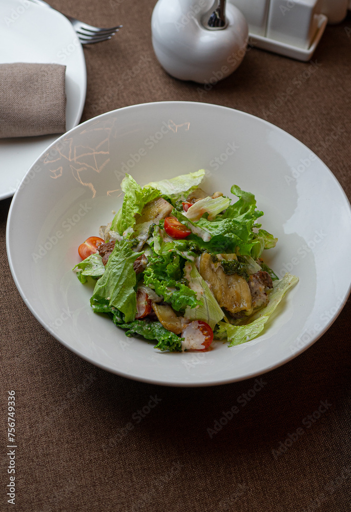 Caesar salad with a signature dressing at an exquisite restaurant.