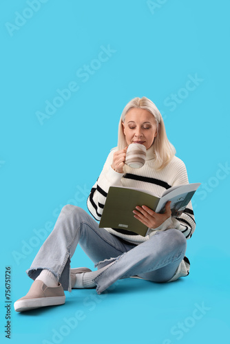 Mature woman with magazine ...