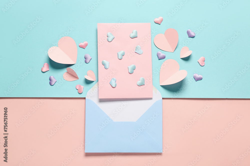 Composition with envelope, card and hearts on color background. Valentine's Day celebration