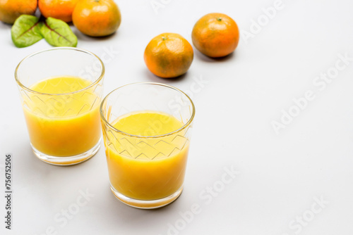 Citrus fruit juice in glasses.