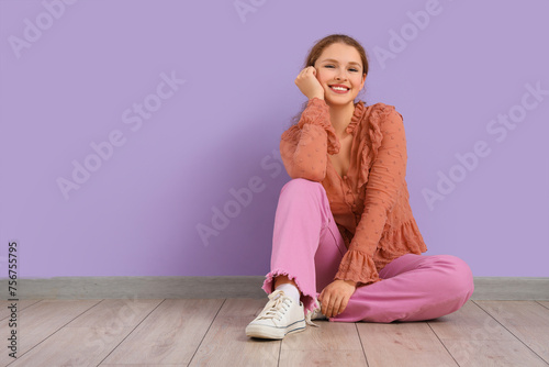 Smiling young redhead woman...