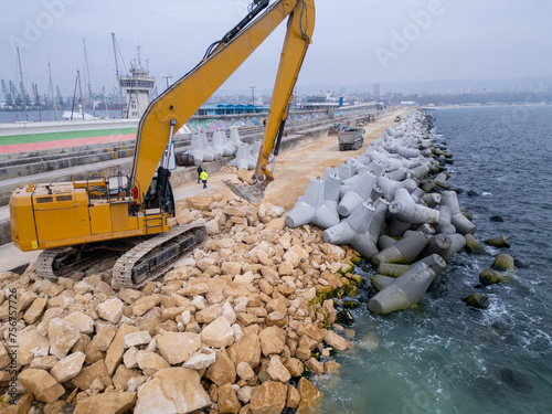 Rows of Concrete Blocks Along Beach photo