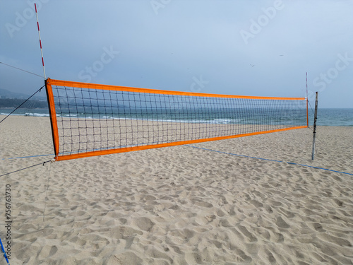 Volleyball Net on Beach by Ocean