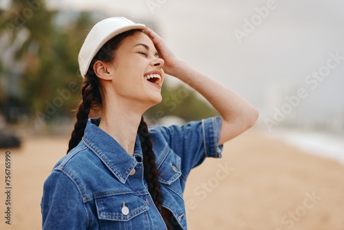 Happy Young Woman Enjoying Summer Sunshine on Beach