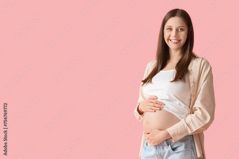 Young pregnant woman on pink background Young pregnant woman on pink background