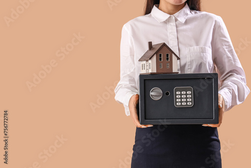 Young Asian woman with safe...