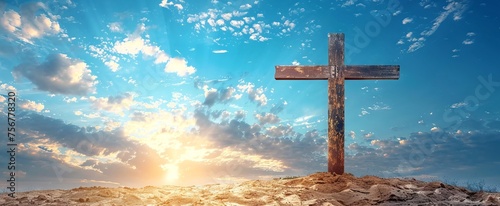 Wooden cross on hill under radiant sun and blue sky. Concept of hope, Easter celebration, resurrection, divine presence, religious faith, memorial, natural burial, and remembrance. Copy space. Banner.