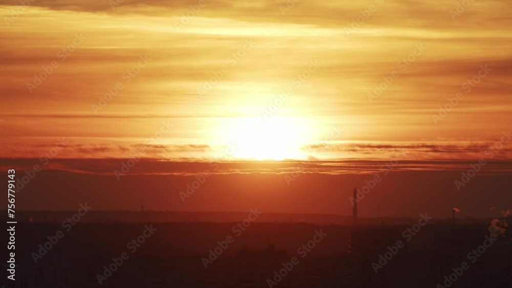 An amber sunset blankets the skyline, highlighting the contours of domes and industrial structures against a dramatic sky. An amber sunset blankets the skyline, highlighting the contours of domes and industrial structures against a dramatic sky.