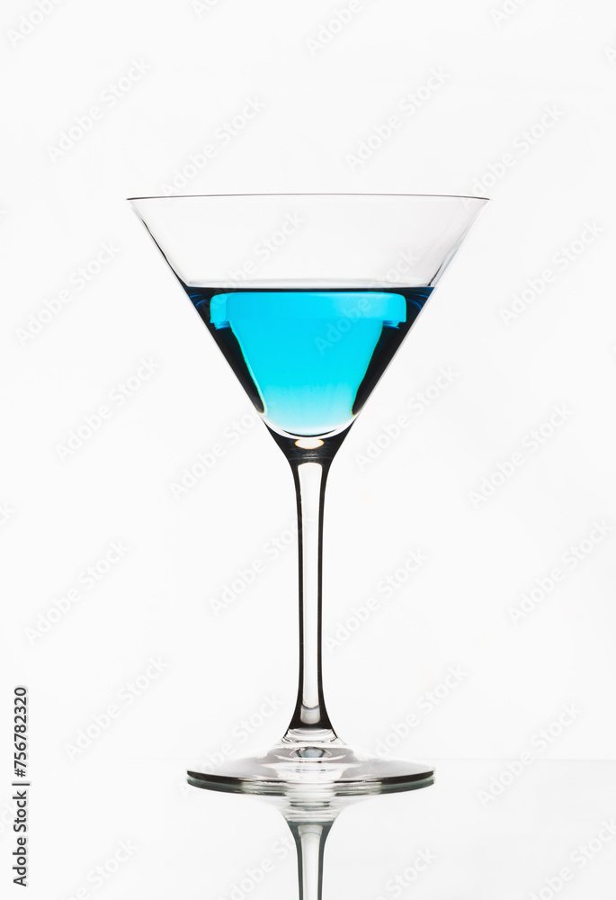 Blue cocktail isolated on white. One blue cocktail martini isolated. Blue cocktail isolated on white. One blue cocktail martini isolated.