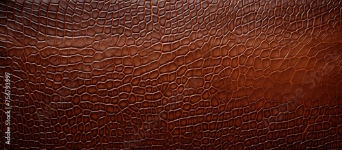 Detailed close up of a rich brown leather texture, resembling wood with tints and shades of peach and soil. The pattern creates a landscape of rectangles, reminiscent of flooring or metal accents