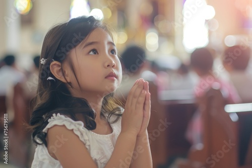 cute small girl praying in the church and Jesus giving blessing, cinematic effect, studios light.  photo