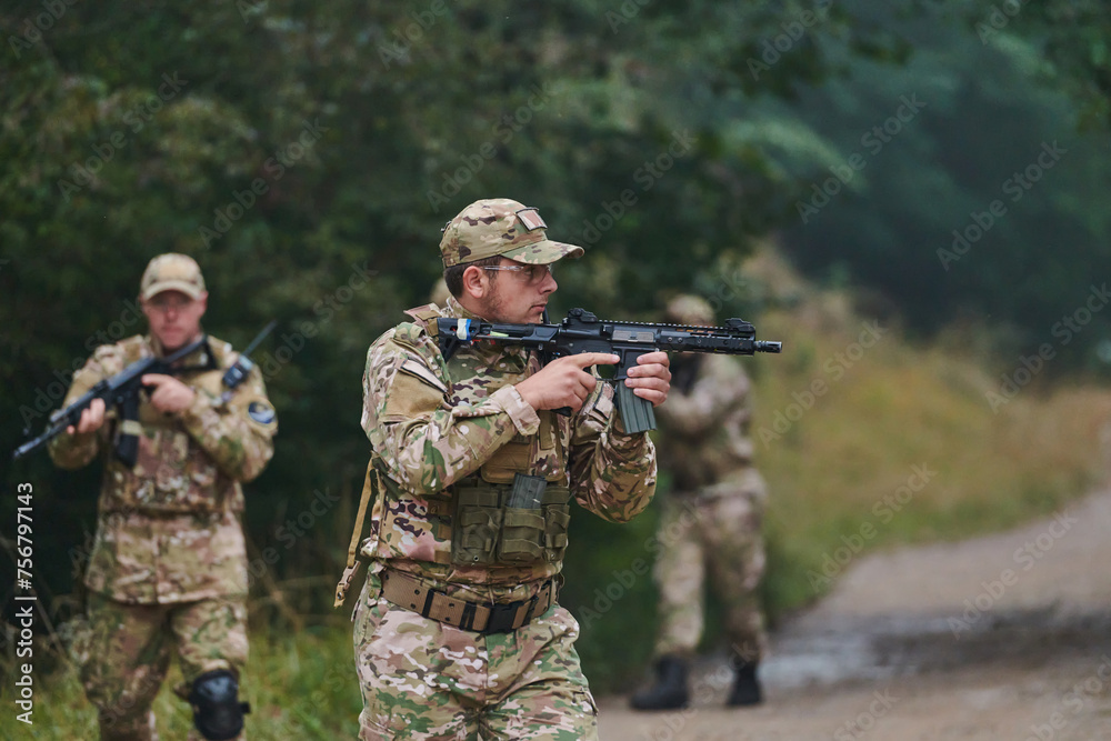 Fototapeta premium A disciplined and specialized military unit, donned in camouflage, strategically patrolling and maintaining control in a high-stakes environment, showcasing their precision, unity, and readiness for