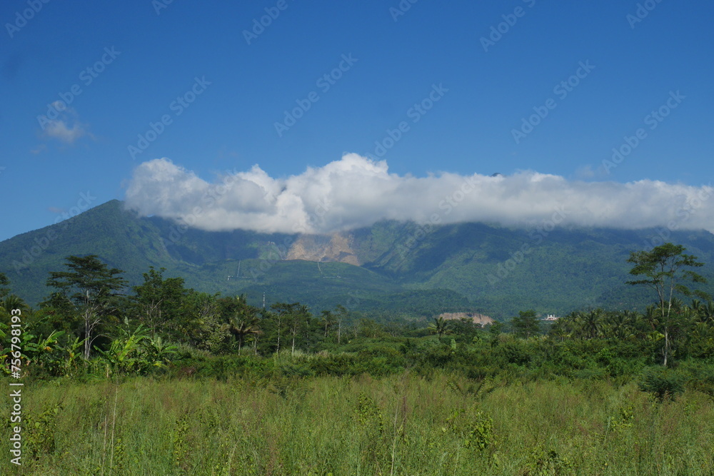 View of Mount Galunggung with its large gaping crater visible from Tasikmalaya city, West Java.	