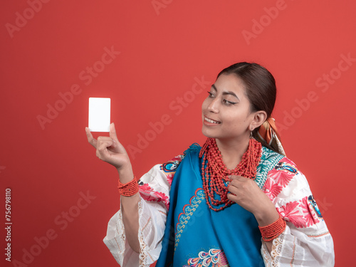 happy hispanic kichwa girl pointing to a credit card photo