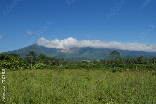 View of Mount Galunggung with its large gaping crater visible from Tasikmalaya city, West Java.
