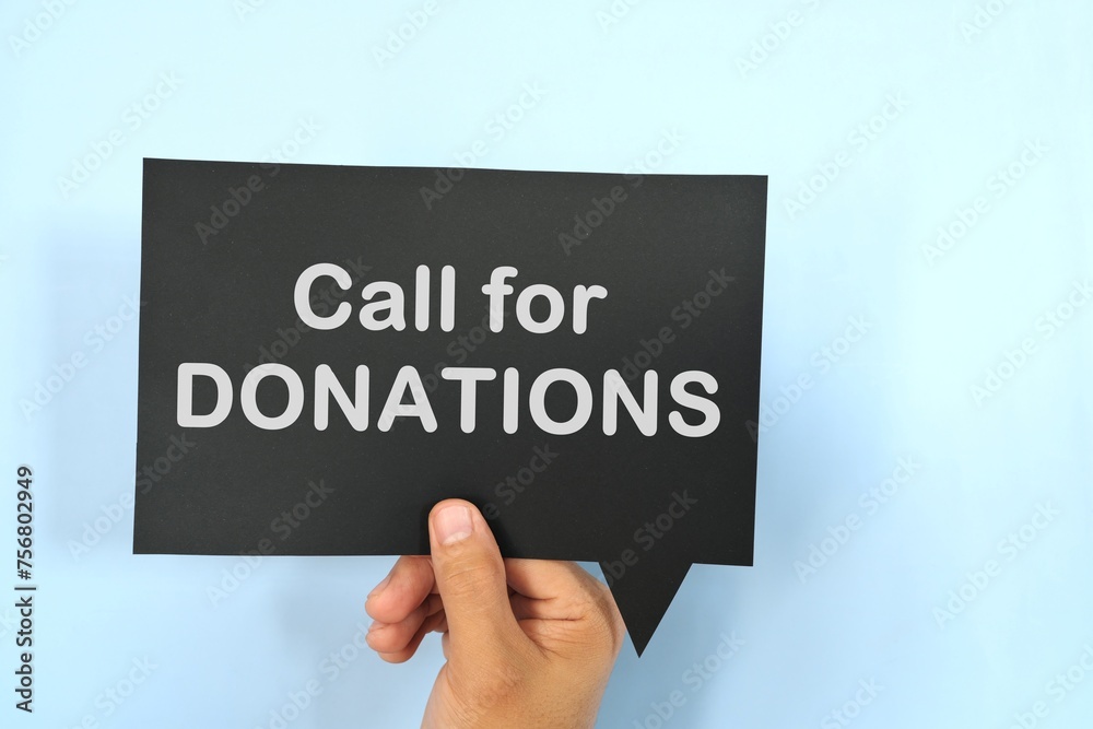Human hand holding speech bubble with written phrase Call for Donations. Charity donations call invitation. Human hand holding speech bubble with written phrase Call for Donations. Charity donations call invitation.