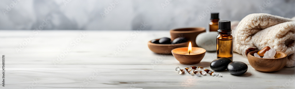 Beautiful composition with spa stones, bath towels on white marble table. Background with copy space Beautiful composition with spa stones, bath towels on white marble table. Background with copy space