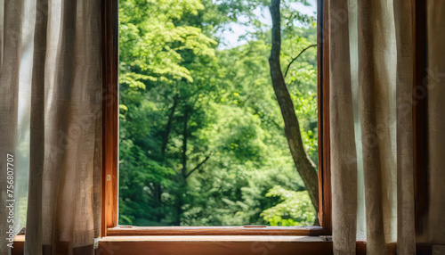 An open window frames a lush green forest, inviting the outside in