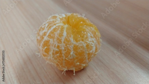 the fresh orange has been peeled