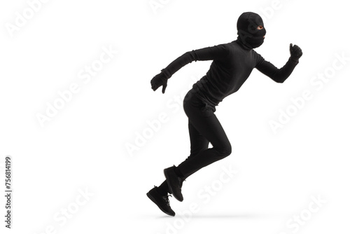 Full length profile shot of a thief in black clothes and balaclava running © Ljupco Smokovski