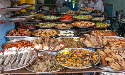 Platters of Thai food in a street kitchen