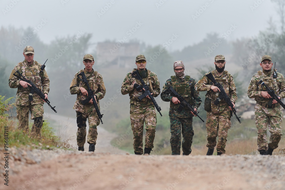 Fototapeta premium A disciplined and specialized military unit, donned in camouflage, strategically patrolling and maintaining control in a high-stakes environment, showcasing their precision, unity, and readiness for