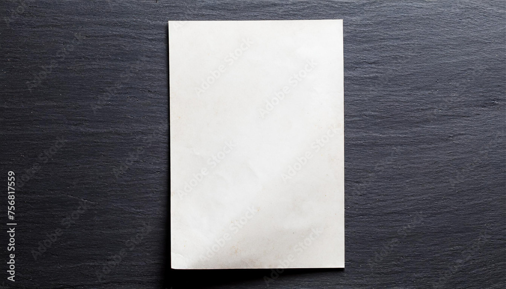 Fototapeta premium a piece of paper on a black wall
