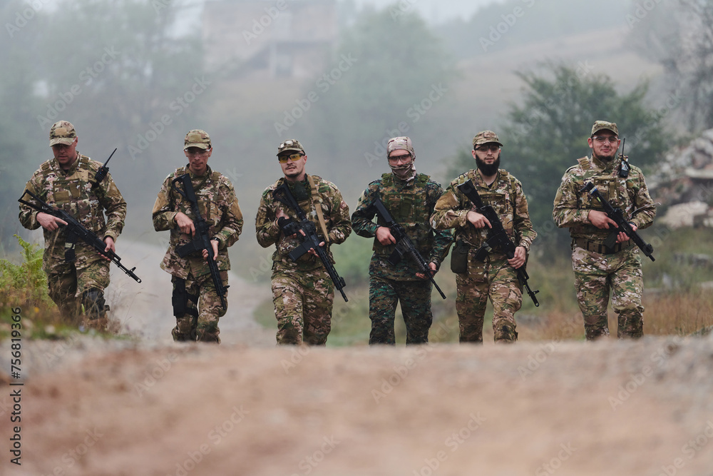 Fototapeta premium A disciplined and specialized military unit, donned in camouflage, strategically patrolling and maintaining control in a high-stakes environment, showcasing their precision, unity, and readiness for