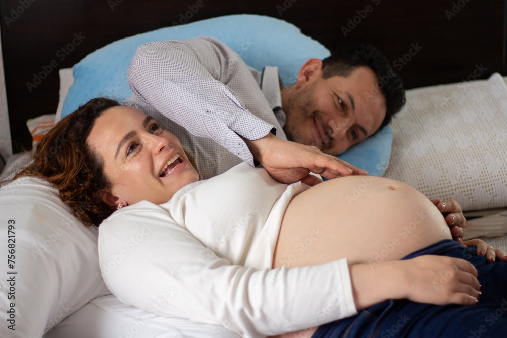 Pregnant couple enjoying time at home Pregnant couple enjoying time at home