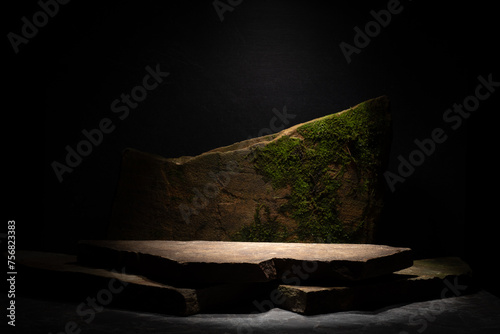 natural stones for the podium. podium with stones on a dark background for the presentation of cosmetology products, perfumery, medicine, skin care, jewelry. © serhii