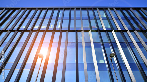 Wallpaper Mural Modern office building with glass facade. Transparent glass wall of office building. Reflection of the blue sky on the facade of the building. Torontodigital.ca
