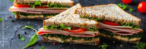 Delicious triangle sandwich with ham, cheese, tomato salad on neutral background with copy space