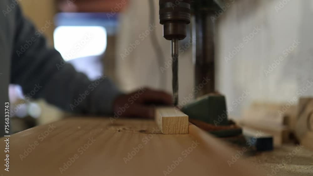 Man working wood in his carpentry shop Man working wood in his carpentry shop
