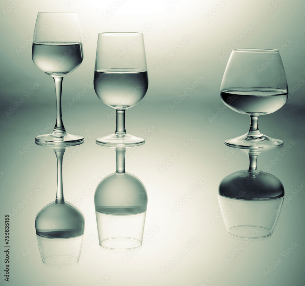 Three wine glasses different shape close up view with reflections Three wine glasses different shape close up view with reflections
