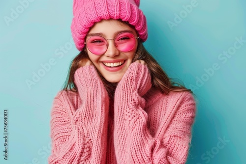 Happy girl in pink winter outfit and glasses © InfiniteStudio
