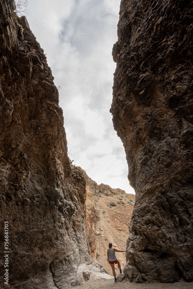 Hiker Stands At The Brink Of The Upper Burro Mesa Pour Off In Big Bend