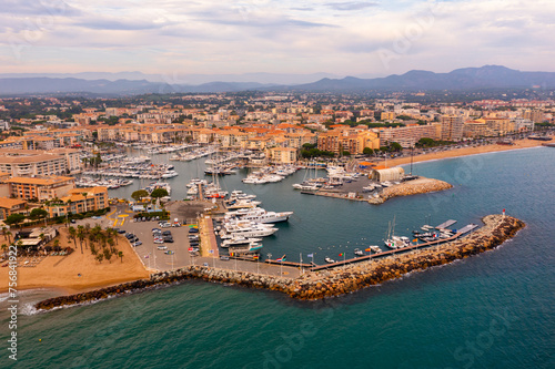 Aerial cityscape of France city Frejus with yachts in the harbor